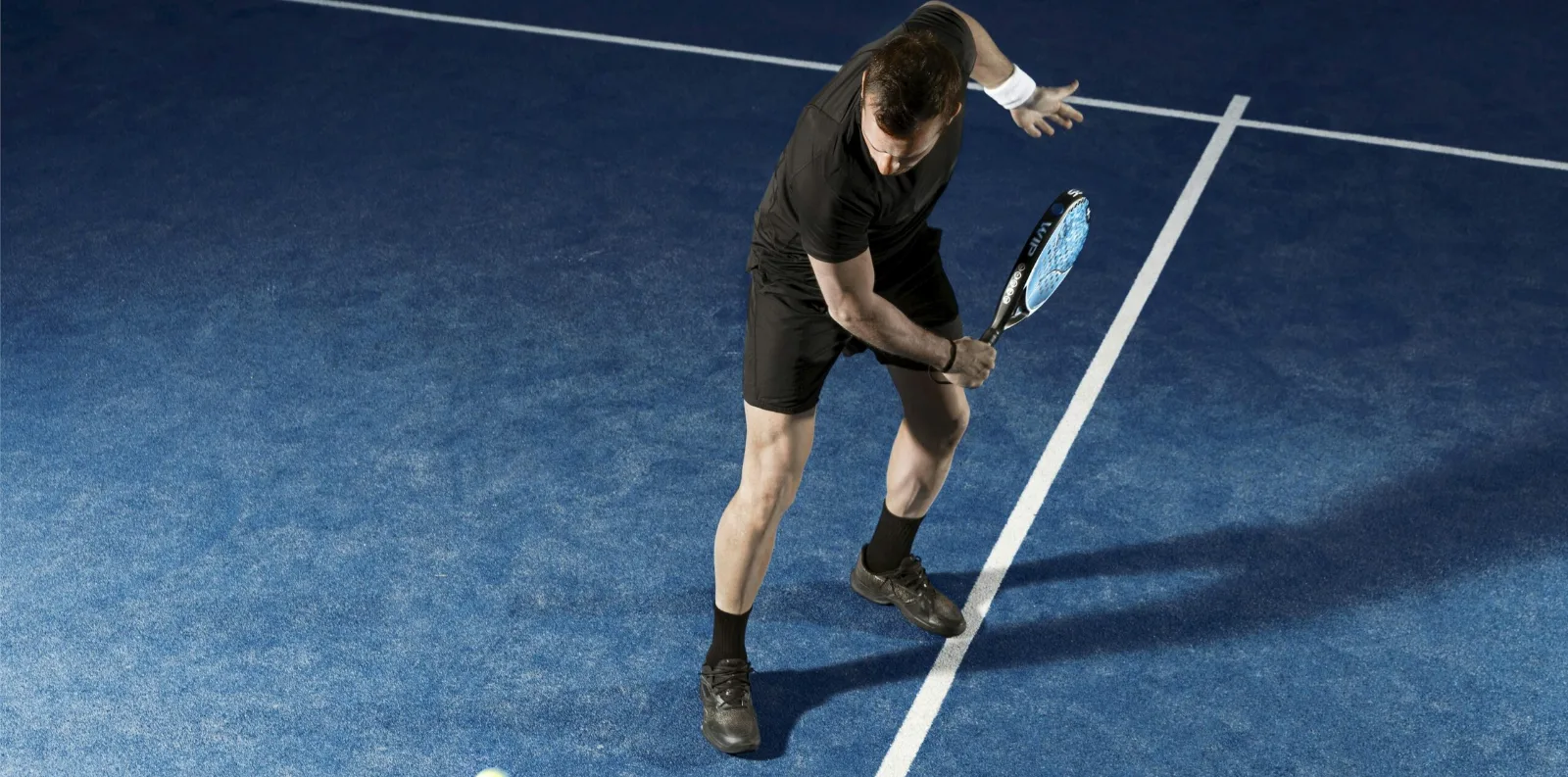 Padel player on court at a Premium Sport Camps private camp