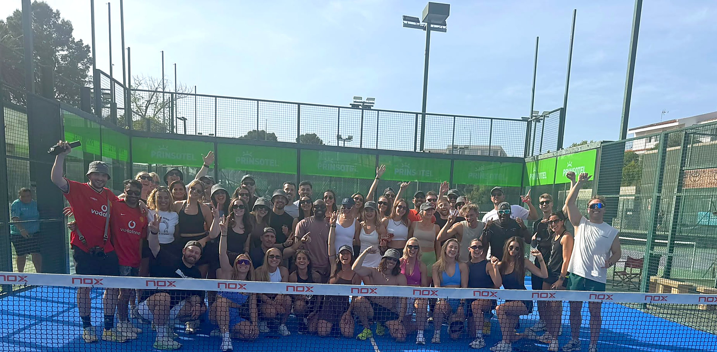 Group of padel players on court at Palma Racket Club, Mallorca